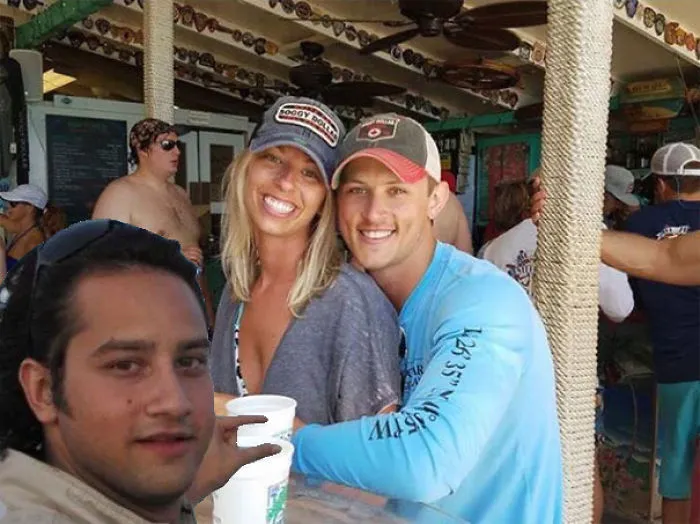 Couple Asks Internet To Photoshop Out Shirtless Guy From Engagement Photo, Regrets It Immediately