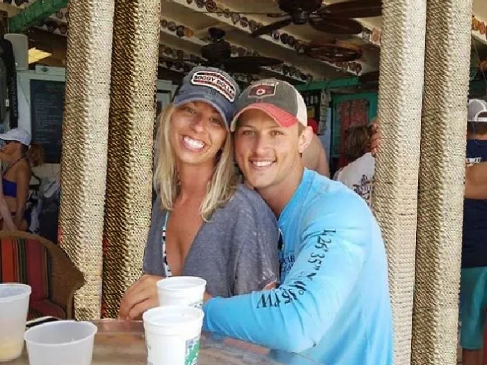 Couple Asks Internet To Photoshop Out Shirtless Guy From Engagement Photo, Regrets It Immediately
