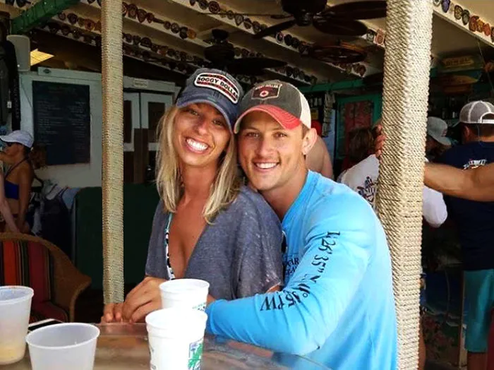 Couple Asks Internet To Photoshop Out Shirtless Guy From Engagement Photo, Regrets It Immediately