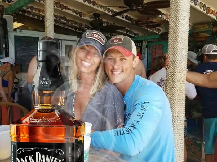 Couple Asks Internet To Photoshop Out Shirtless Guy From Engagement Photo, Regrets It Immediately