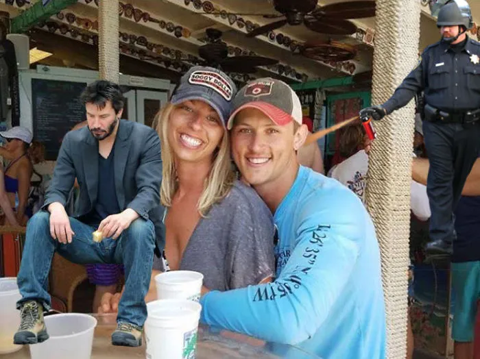 Couple Asks Internet To Photoshop Out Shirtless Guy From Engagement Photo, Regrets It Immediately