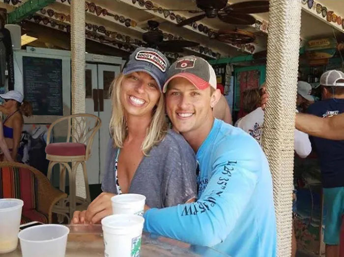 Couple Asks Internet To Photoshop Out Shirtless Guy From Engagement Photo, Regrets It Immediately