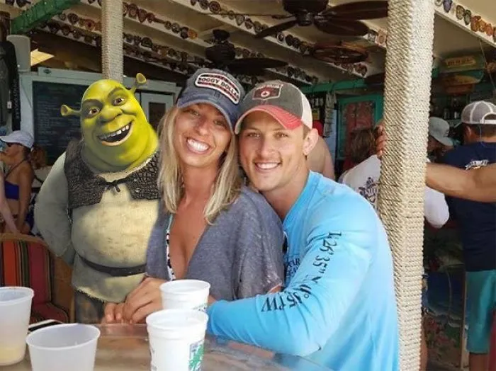 Couple Asks Internet To Photoshop Out Shirtless Guy From Engagement Photo, Regrets It Immediately