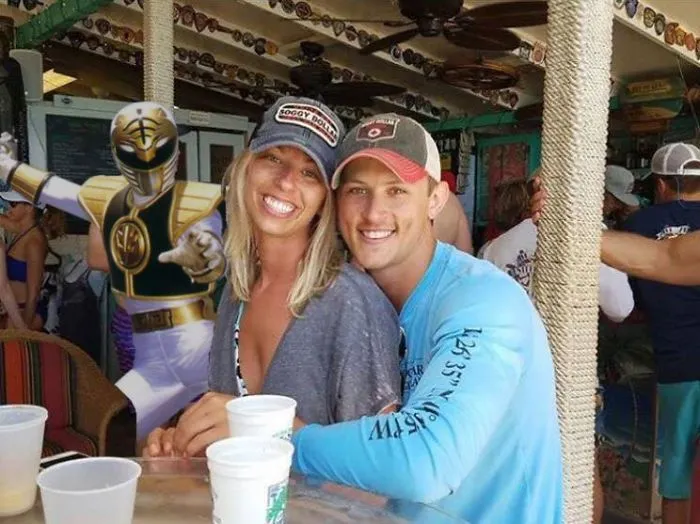 Couple Asks Internet To Photoshop Out Shirtless Guy From Engagement Photo, Regrets It Immediately