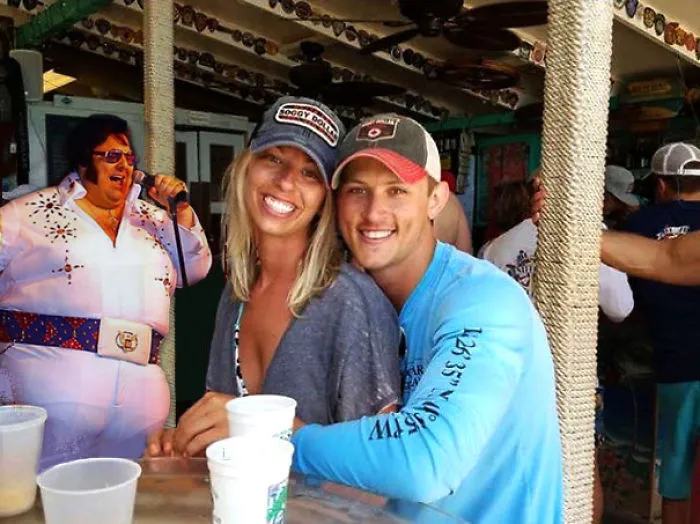 Couple Asks Internet To Photoshop Out Shirtless Guy From Engagement Photo, Regrets It Immediately