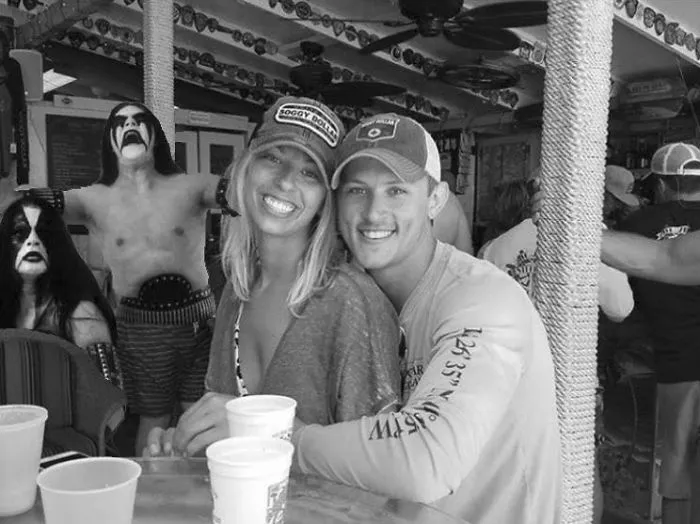 Couple Asks Internet To Photoshop Out Shirtless Guy From Engagement Photo, Regrets It Immediately