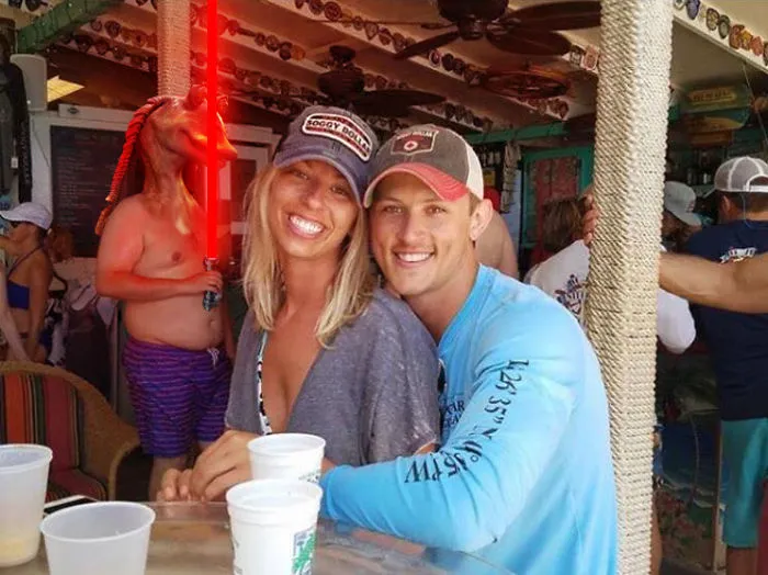 Couple Asks Internet To Photoshop Out Shirtless Guy From Engagement Photo, Regrets It Immediately