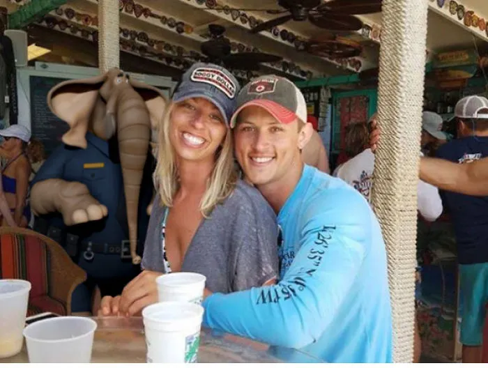 Couple Asks Internet To Photoshop Out Shirtless Guy From Engagement Photo, Regrets It Immediately