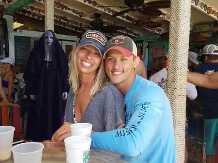 Couple Asks Internet To Photoshop Out Shirtless Guy From Engagement Photo, Regrets It Immediately