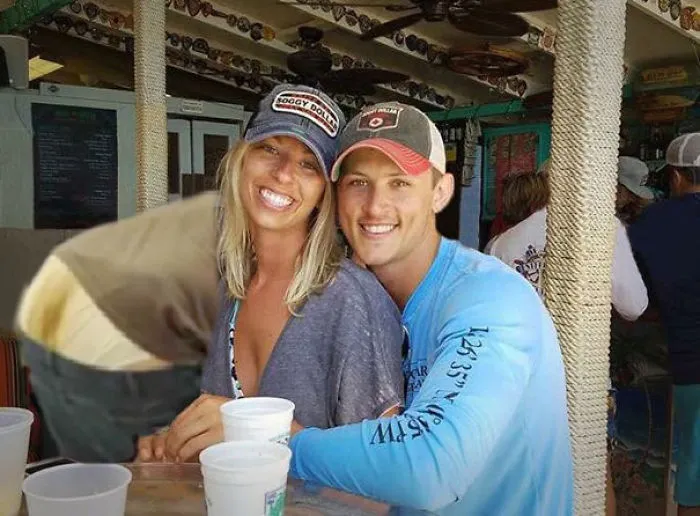 Couple Asks Internet To Photoshop Out Shirtless Guy From Engagement Photo, Regrets It Immediately