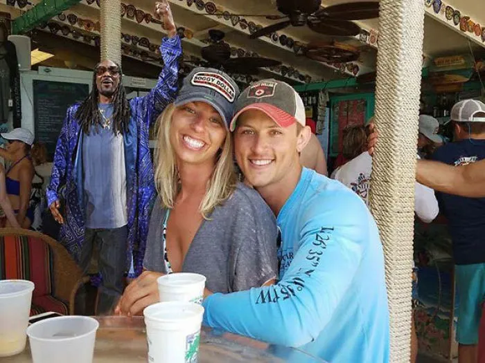 Couple Asks Internet To Photoshop Out Shirtless Guy From Engagement Photo, Regrets It Immediately