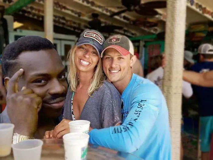 Couple Asks Internet To Photoshop Out Shirtless Guy From Engagement Photo, Regrets It Immediately