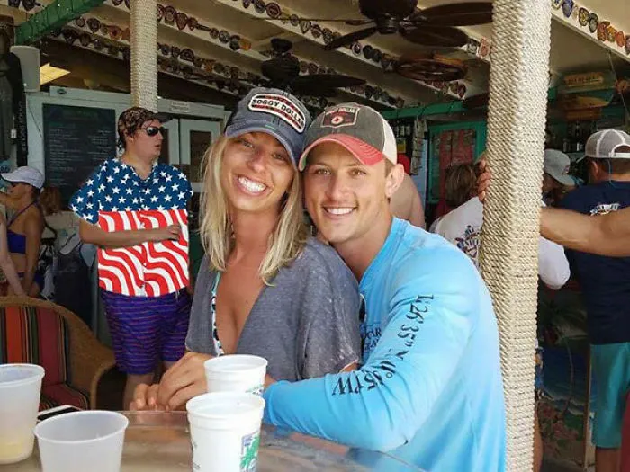 Couple Asks Internet To Photoshop Out Shirtless Guy From Engagement Photo, Regrets It Immediately