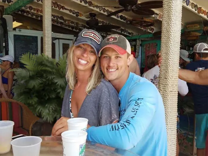 Couple Asks Internet To Photoshop Out Shirtless Guy From Engagement Photo, Regrets It Immediately