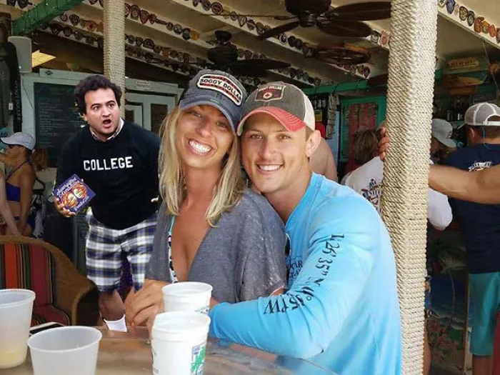 Couple Asks Internet To Photoshop Out Shirtless Guy From Engagement Photo, Regrets It Immediately