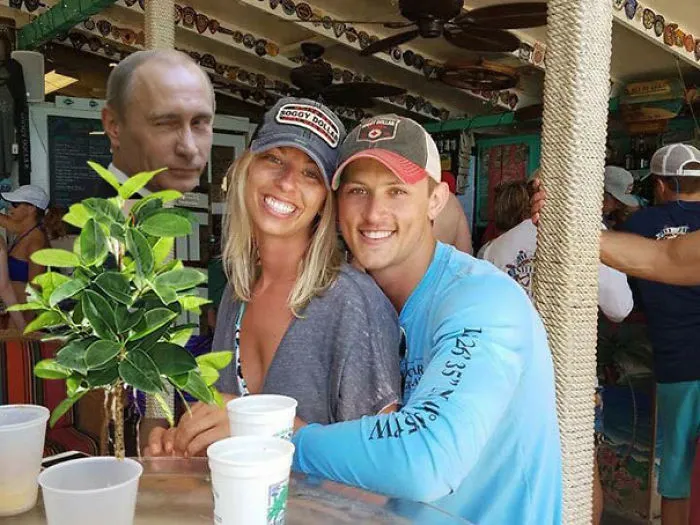 Couple Asks Internet To Photoshop Out Shirtless Guy From Engagement Photo, Regrets It Immediately