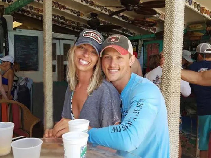 Couple Asks Internet To Photoshop Out Shirtless Guy From Engagement Photo, Regrets It Immediately