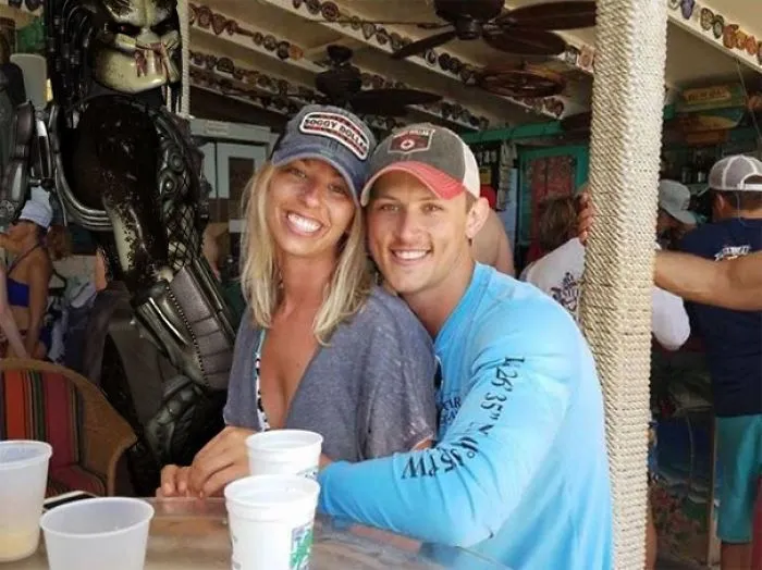 Couple Asks Internet To Photoshop Out Shirtless Guy From Engagement Photo, Regrets It Immediately