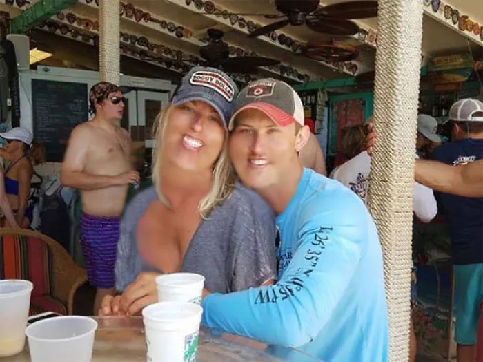 Couple Asks Internet To Photoshop Out Shirtless Guy From Engagement Photo, Regrets It Immediately
