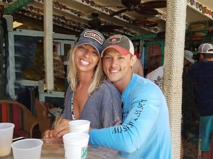 Couple Asks Internet To Photoshop Out Shirtless Guy From Engagement Photo, Regrets It Immediately