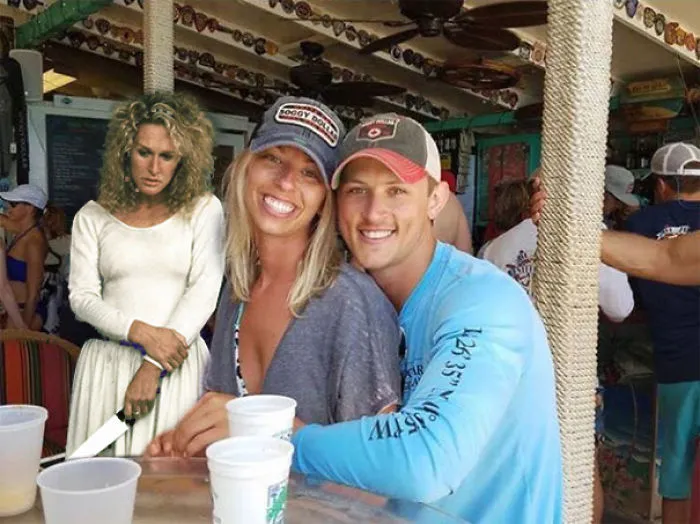 Couple Asks Internet To Photoshop Out Shirtless Guy From Engagement Photo, Regrets It Immediately
