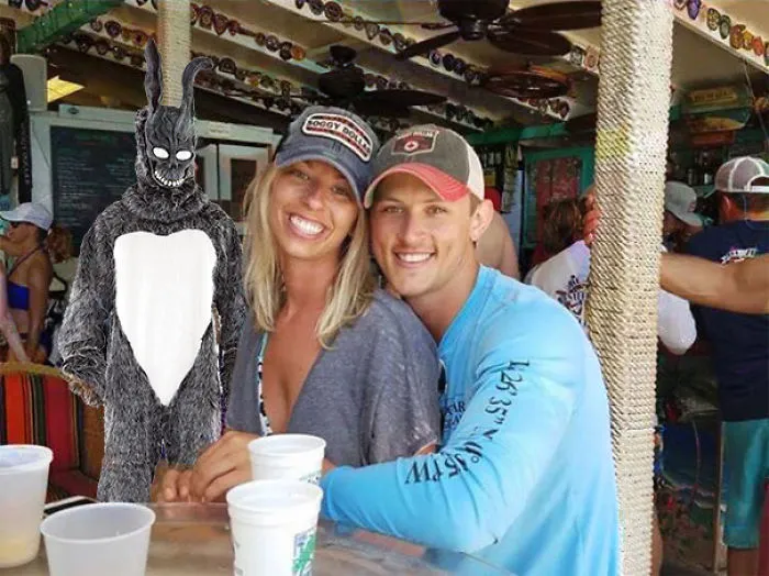 Couple Asks Internet To Photoshop Out Shirtless Guy From Engagement Photo, Regrets It Immediately