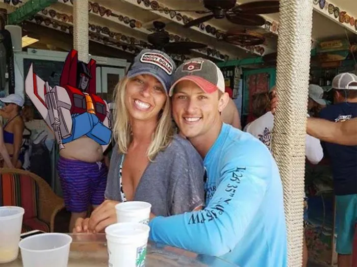 Couple Asks Internet To Photoshop Out Shirtless Guy From Engagement Photo, Regrets It Immediately