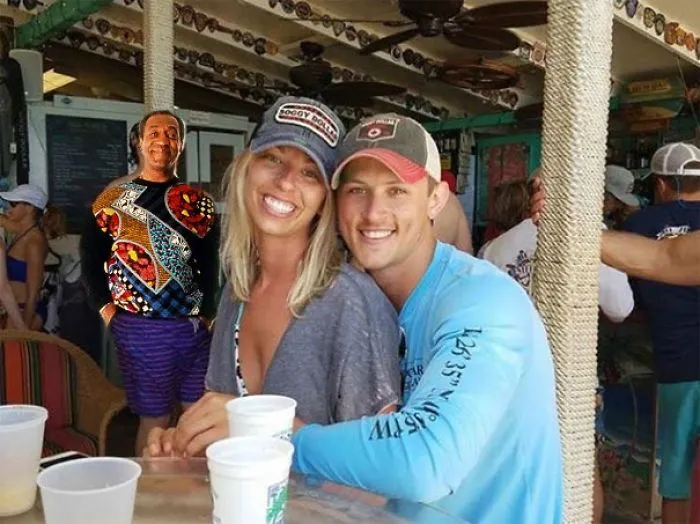 Couple Asks Internet To Photoshop Out Shirtless Guy From Engagement Photo, Regrets It Immediately
