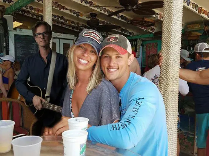 Couple Asks Internet To Photoshop Out Shirtless Guy From Engagement Photo, Regrets It Immediately