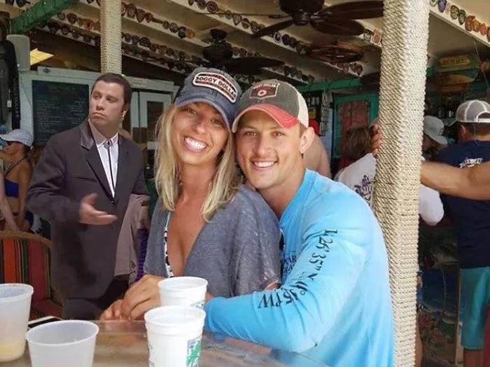 Couple Asks Internet To Photoshop Out Shirtless Guy From Engagement Photo, Regrets It Immediately