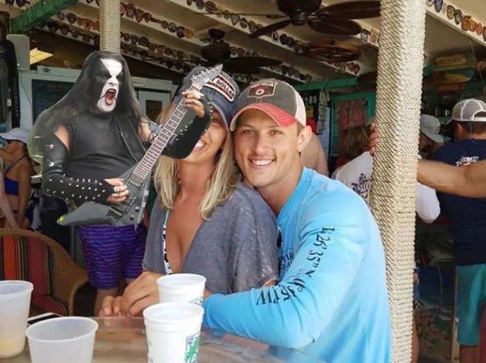 Couple Asks Internet To Photoshop Out Shirtless Guy From Engagement Photo, Regrets It Immediately