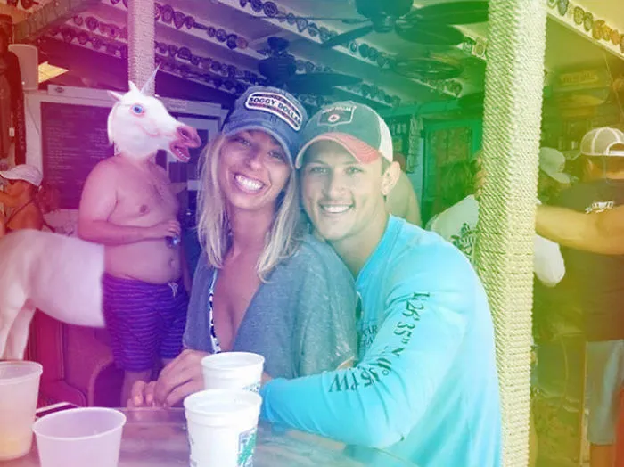 Couple Asks Internet To Photoshop Out Shirtless Guy From Engagement Photo, Regrets It Immediately