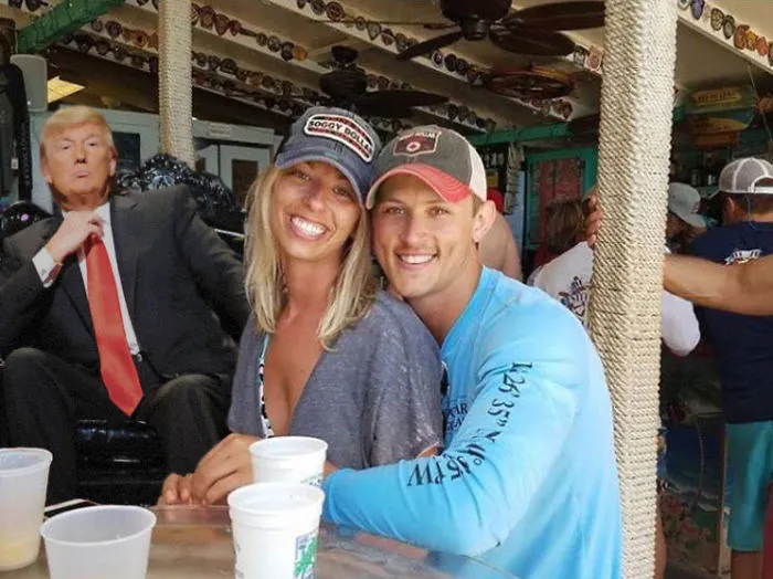 Couple Asks Internet To Photoshop Out Shirtless Guy From Engagement Photo, Regrets It Immediately
