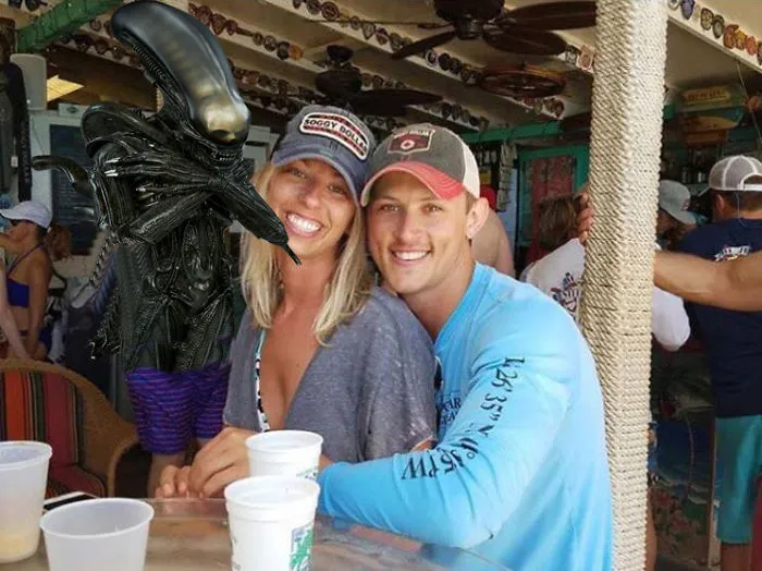Couple Asks Internet To Photoshop Out Shirtless Guy From Engagement Photo, Regrets It Immediately