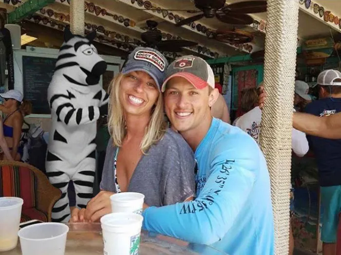 Couple Asks Internet To Photoshop Out Shirtless Guy From Engagement Photo, Regrets It Immediately