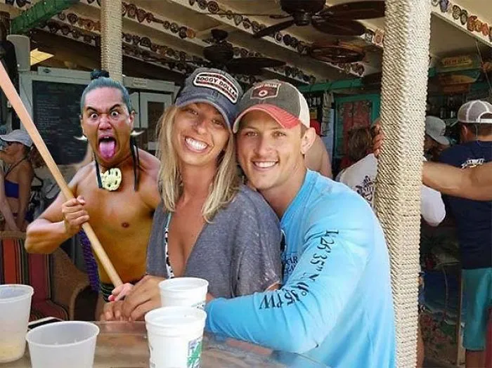 Couple Asks Internet To Photoshop Out Shirtless Guy From Engagement Photo, Regrets It Immediately