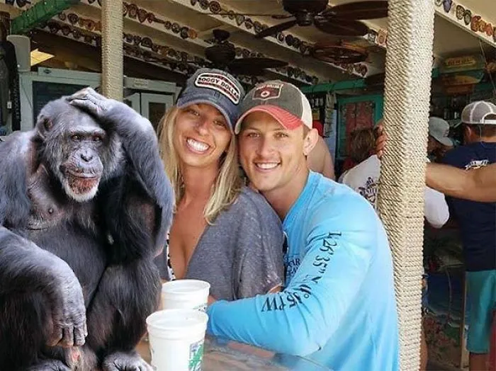 Couple Asks Internet To Photoshop Out Shirtless Guy From Engagement Photo, Regrets It Immediately