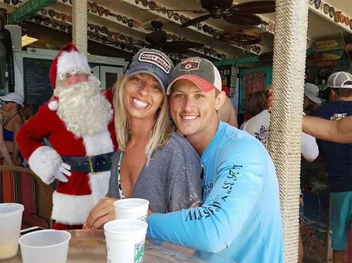 Couple Asks Internet To Photoshop Out Shirtless Guy From Engagement Photo, Regrets It Immediately