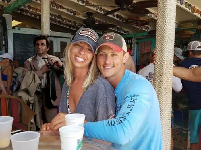 Couple Asks Internet To Photoshop Out Shirtless Guy From Engagement Photo, Regrets It Immediately
