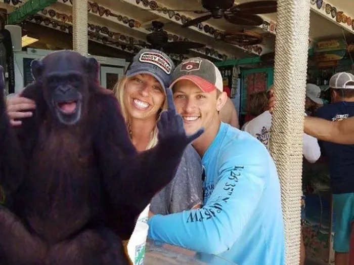 Couple Asks Internet To Photoshop Out Shirtless Guy From Engagement Photo, Regrets It Immediately