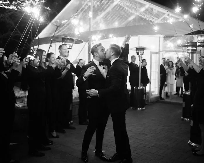 Two men kissing 