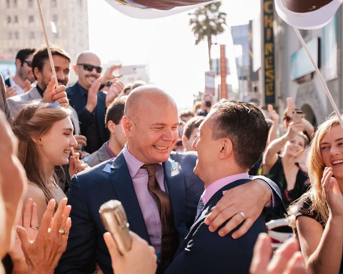 Two happy men hugging 
