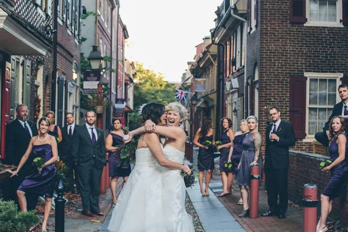 Two happy woman hugging and laughing 