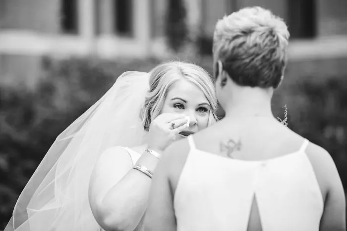 Two happy women hugging and crying 