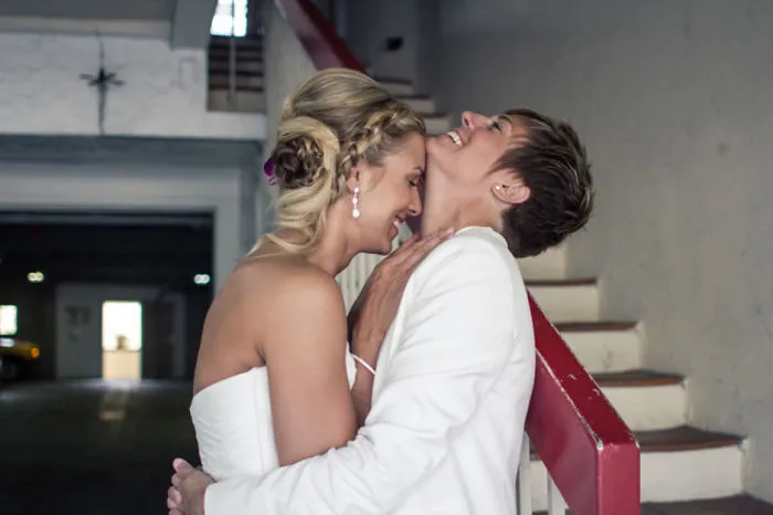 Two happy women hugging 