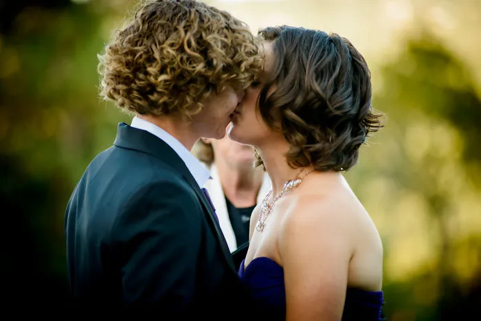 Two women kissing 