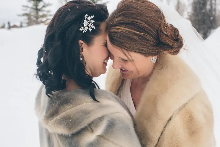 Two women hugging and laughing 