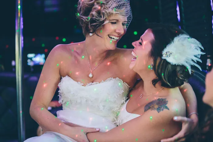 Two woman hugging and laughing 
