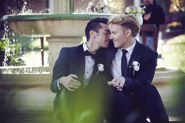 Two men hugging 