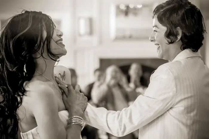 Two women holding hands 